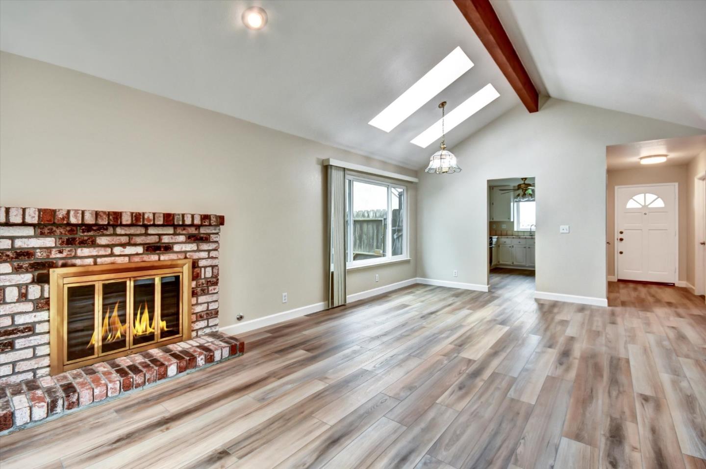 420 Brighton Street Salinas, CA 93907 - Photo 9 of 41 a view of an empty room with wooden floor and a window
