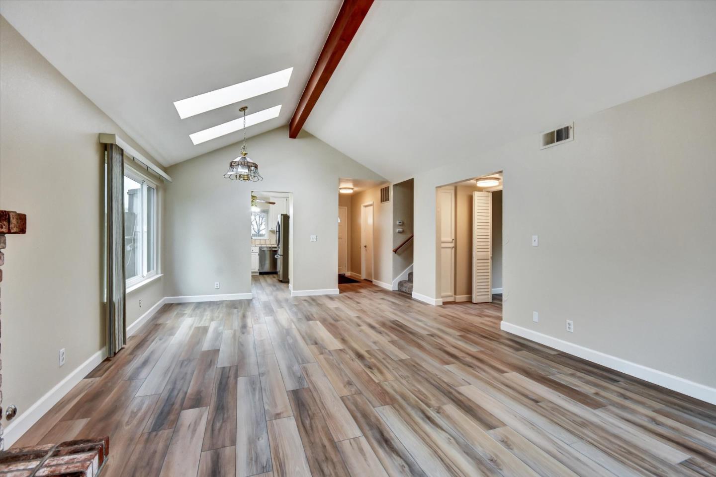 420 Brighton Street Salinas, CA 93907 - Photo 10 of 41 a view of an empty room with wooden floor and a window
