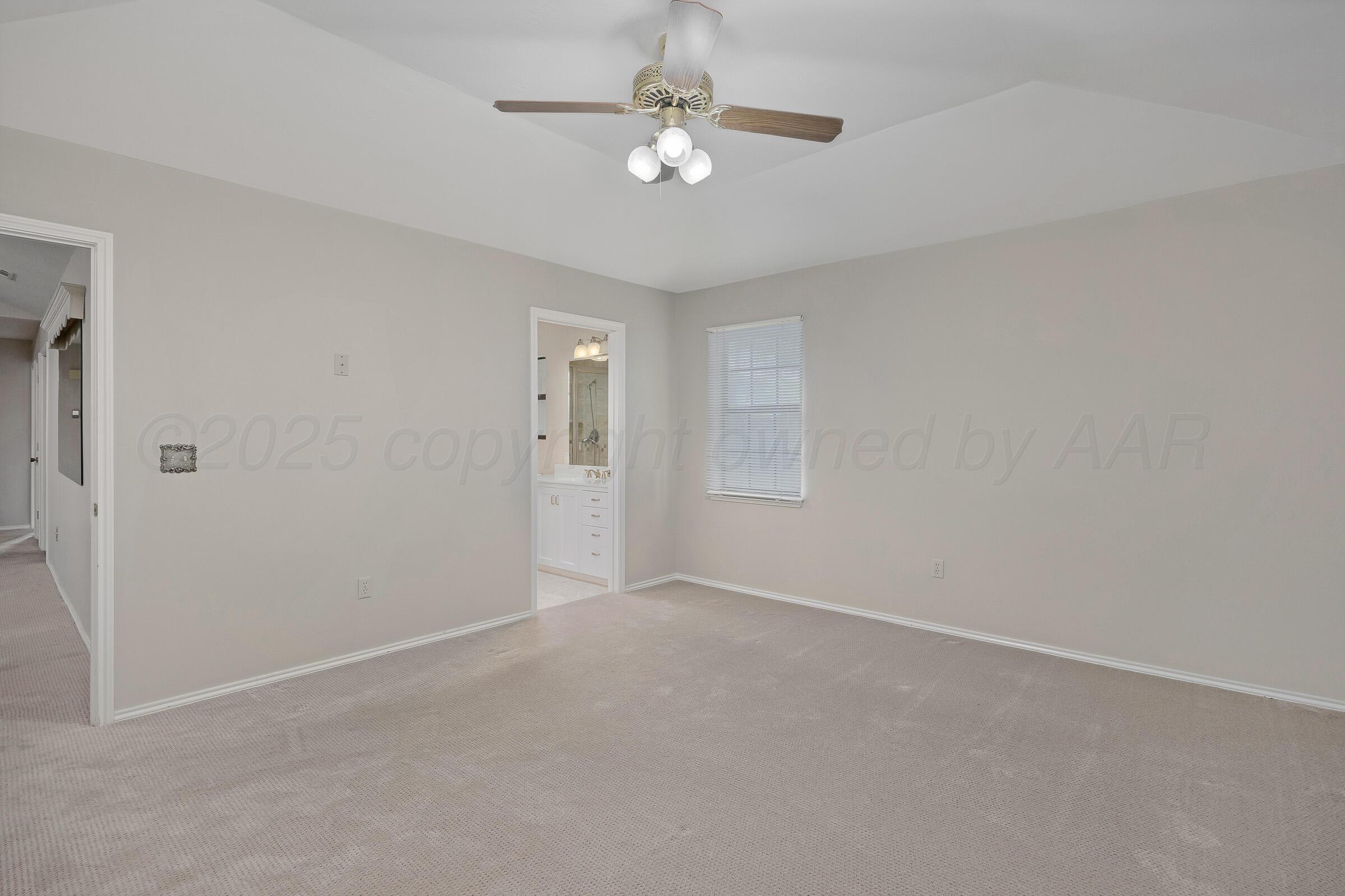 5403 Camp Lane Amarillo, TX 79110 - Photo 13 of 25 an empty room with windows and fan