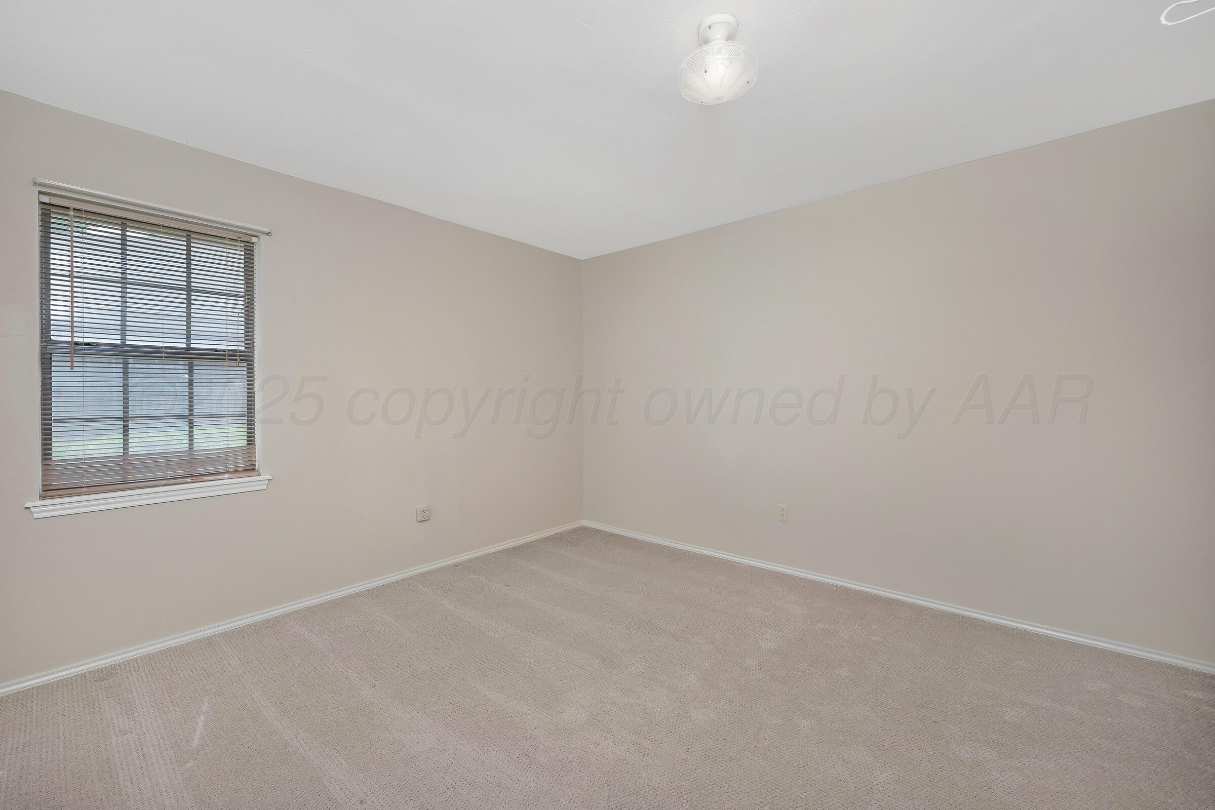 5403 Camp Lane Amarillo, TX 79110 - Photo 14 of 25 an empty room with a window