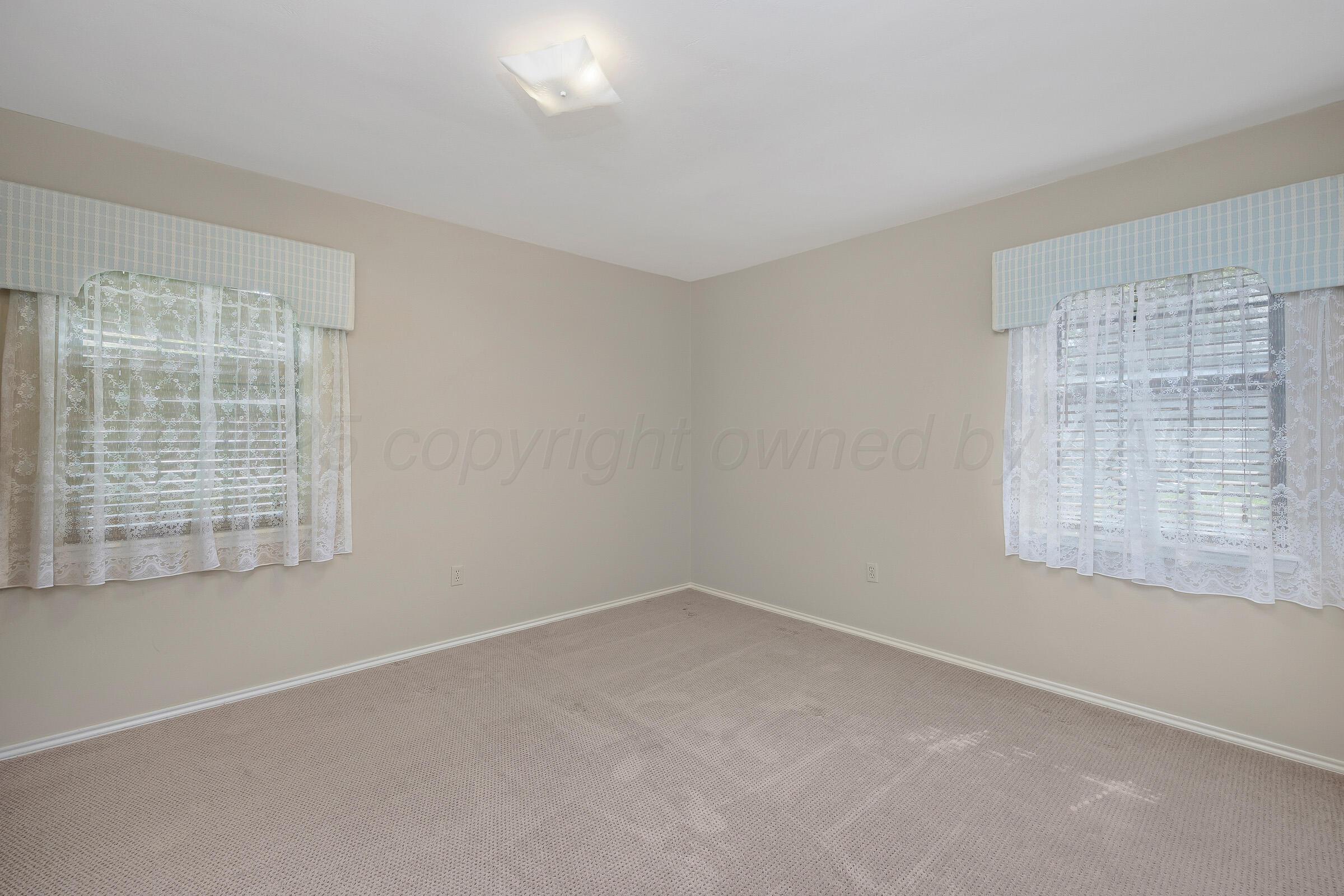 5403 Camp Lane Amarillo, TX 79110 - Photo 16 of 25 an empty room with a window