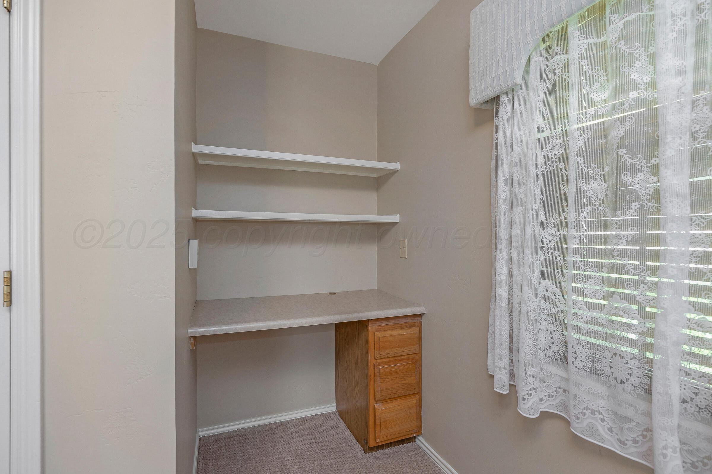 5403 Camp Lane Amarillo, TX 79110 - Photo 17 of 25 a view of walk in closet with empty racks