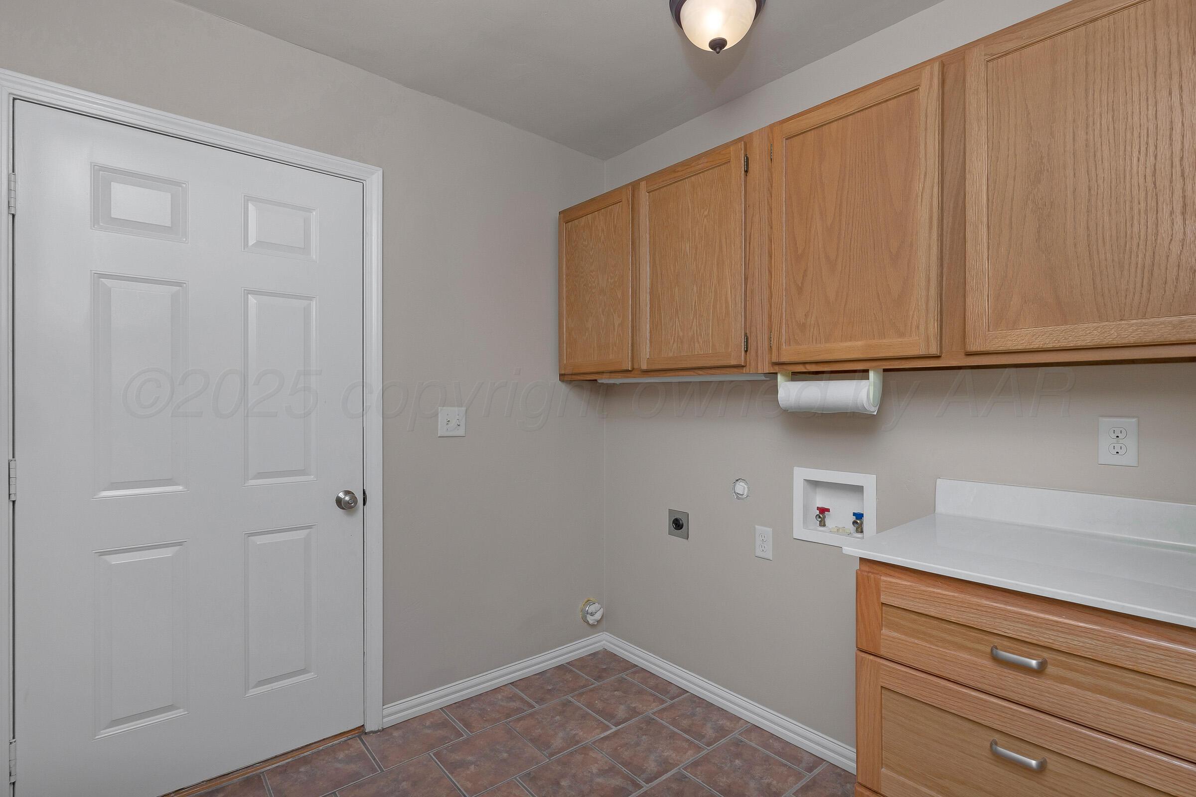 5403 Camp Lane Amarillo, TX 79110 - Photo 19 of 25 a view of cabinets and wooden closet