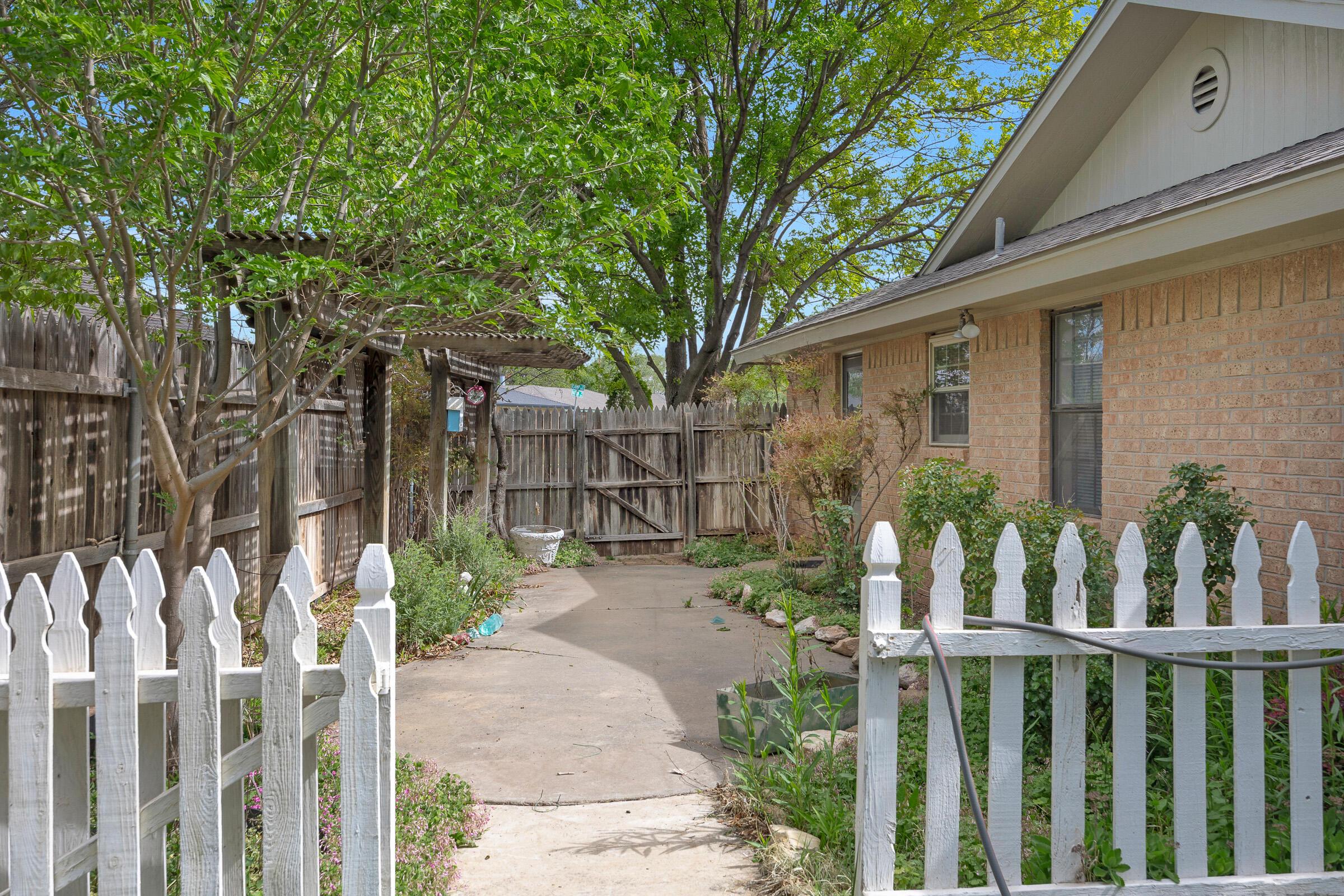 5403 Camp Lane Amarillo, TX 79110 - Photo 23 of 25 a view of small yard and tree