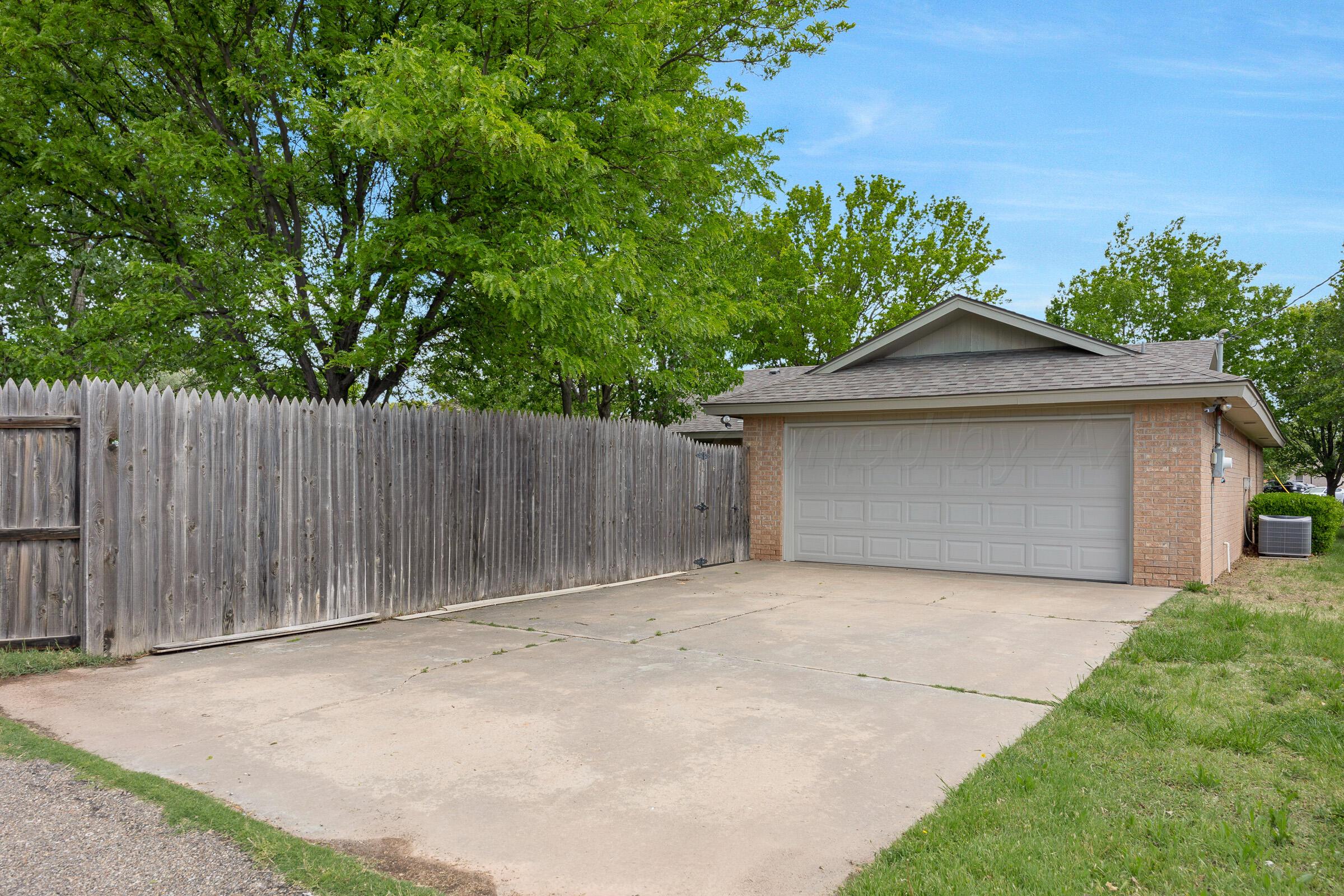 5403 Camp Lane Amarillo, TX 79110 - Photo 25 of 25 a front view of a house with a garage