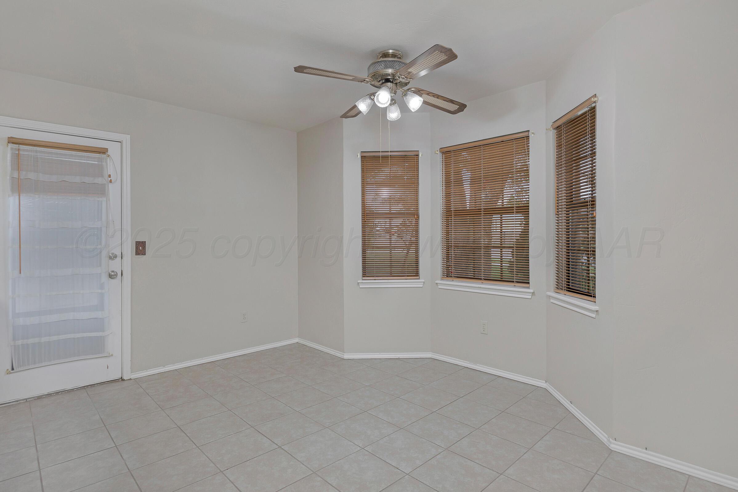 5403 Camp Lane Amarillo, TX 79110 - Photo 10 of 25 a view of an empty room with a chandelier fan