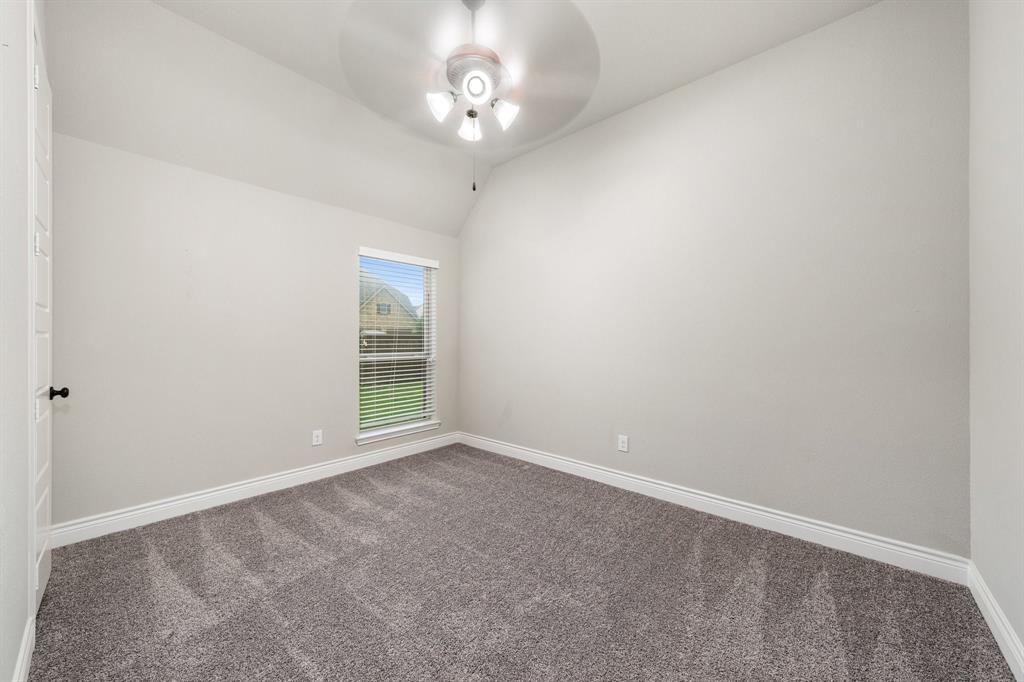 1501 Calcot Lane Forney, TX 75126 - Photo 20 of 34 Carpeted room featuring a single window with blinds, a ceiling fan with integrated lighting, a white paneled door, and white baseboards