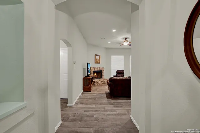 a living room with furniture and a fireplace