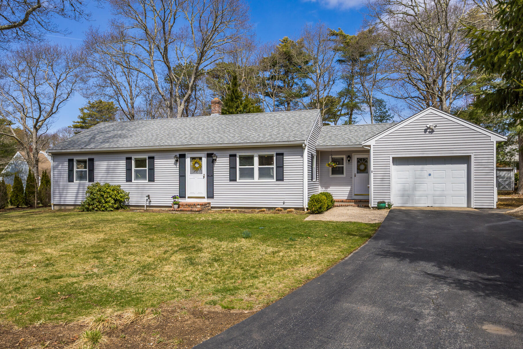 8 Rivers End Road Teaticket, MA 02536 - Photo 2 of 33 a front view of a house with a garden