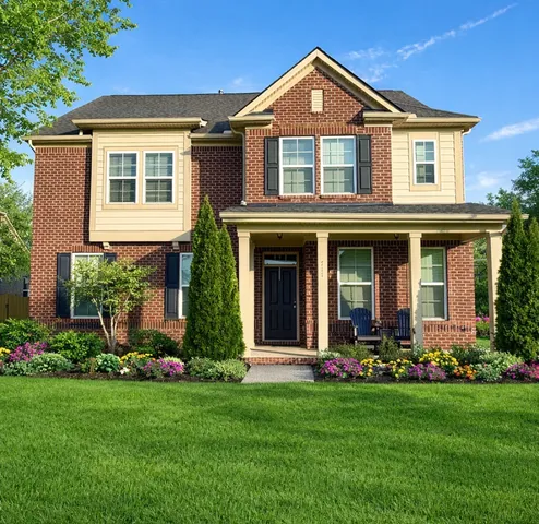 front view of a house with a yard