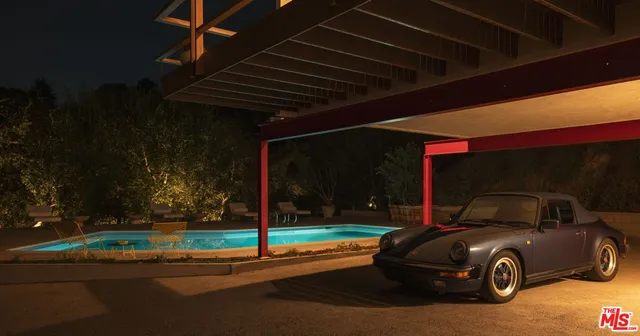 a view of swimming pool with seating area