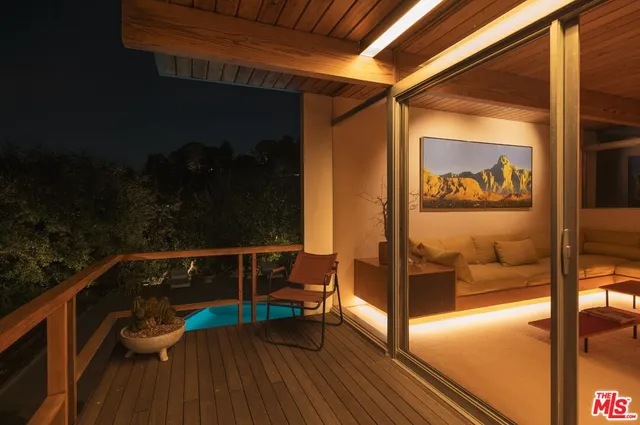 a view of swimming pool with seating space