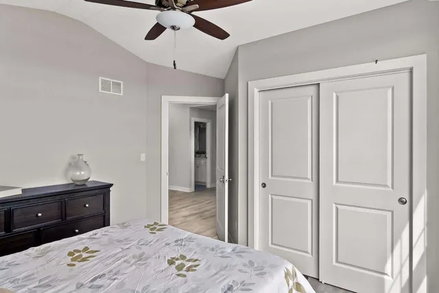 a bedroom with a bed and a dresser