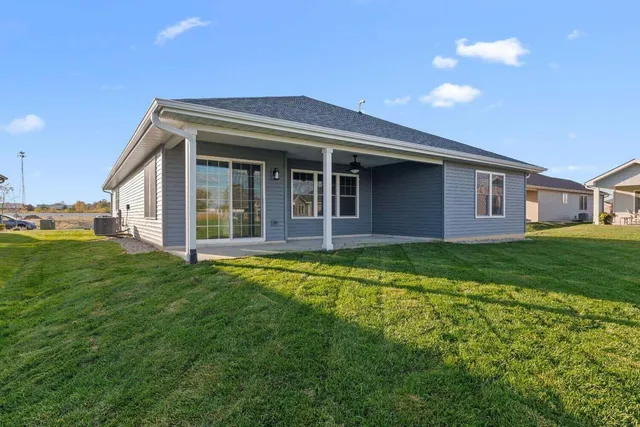 a view of a house with a backyard