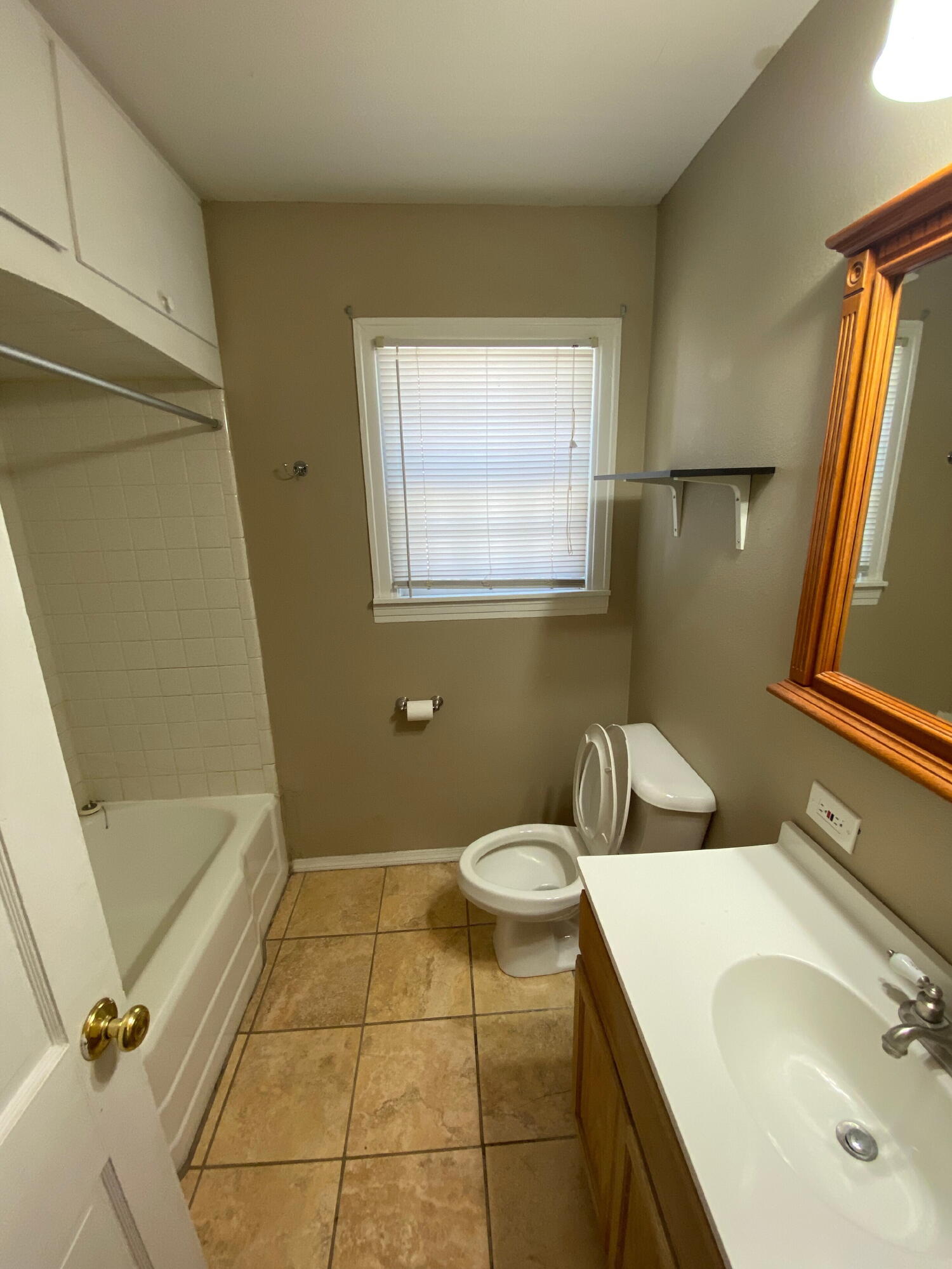 2520 27th Street, Unit FRONT Lubbock, TX 79410 - Photo 11 of 17 a bathroom with a sink and a mirror