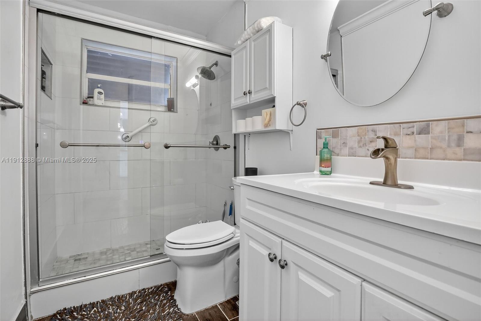 7920 Alhambra Boulevard Miramar, FL 33023 - Photo 29 of 38 a bathroom with a sink a toilet and shower