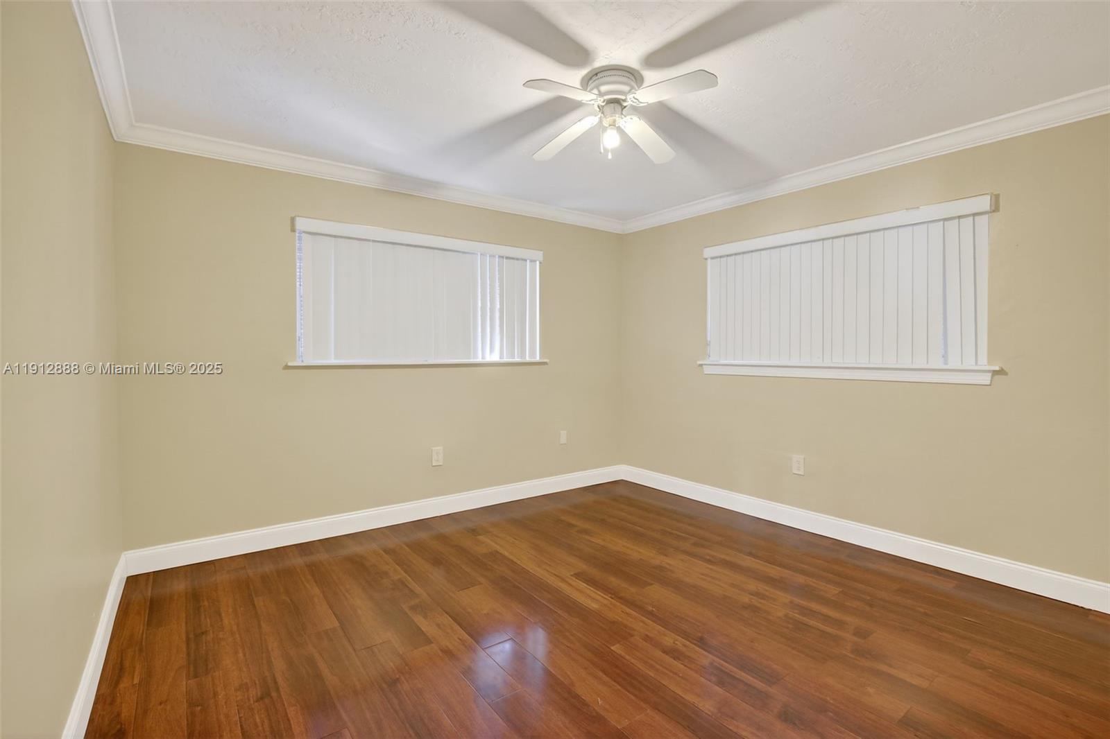 7920 Alhambra Boulevard Miramar, FL 33023 - Photo 30 of 38 a view of an empty room with wooden floor and a window