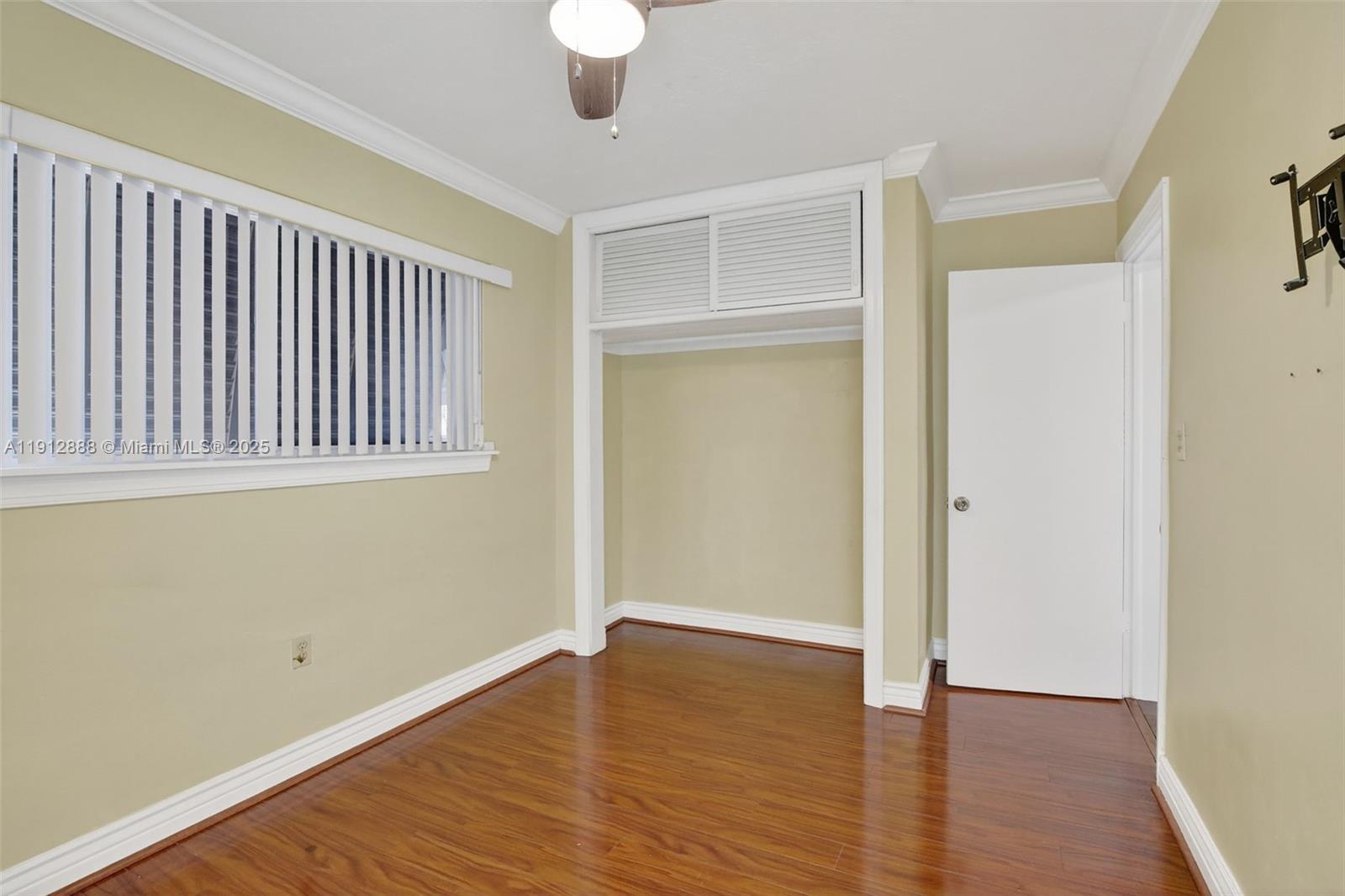 7920 Alhambra Boulevard Miramar, FL 33023 - Photo 33 of 38 a view of an empty room with wooden floor and a window