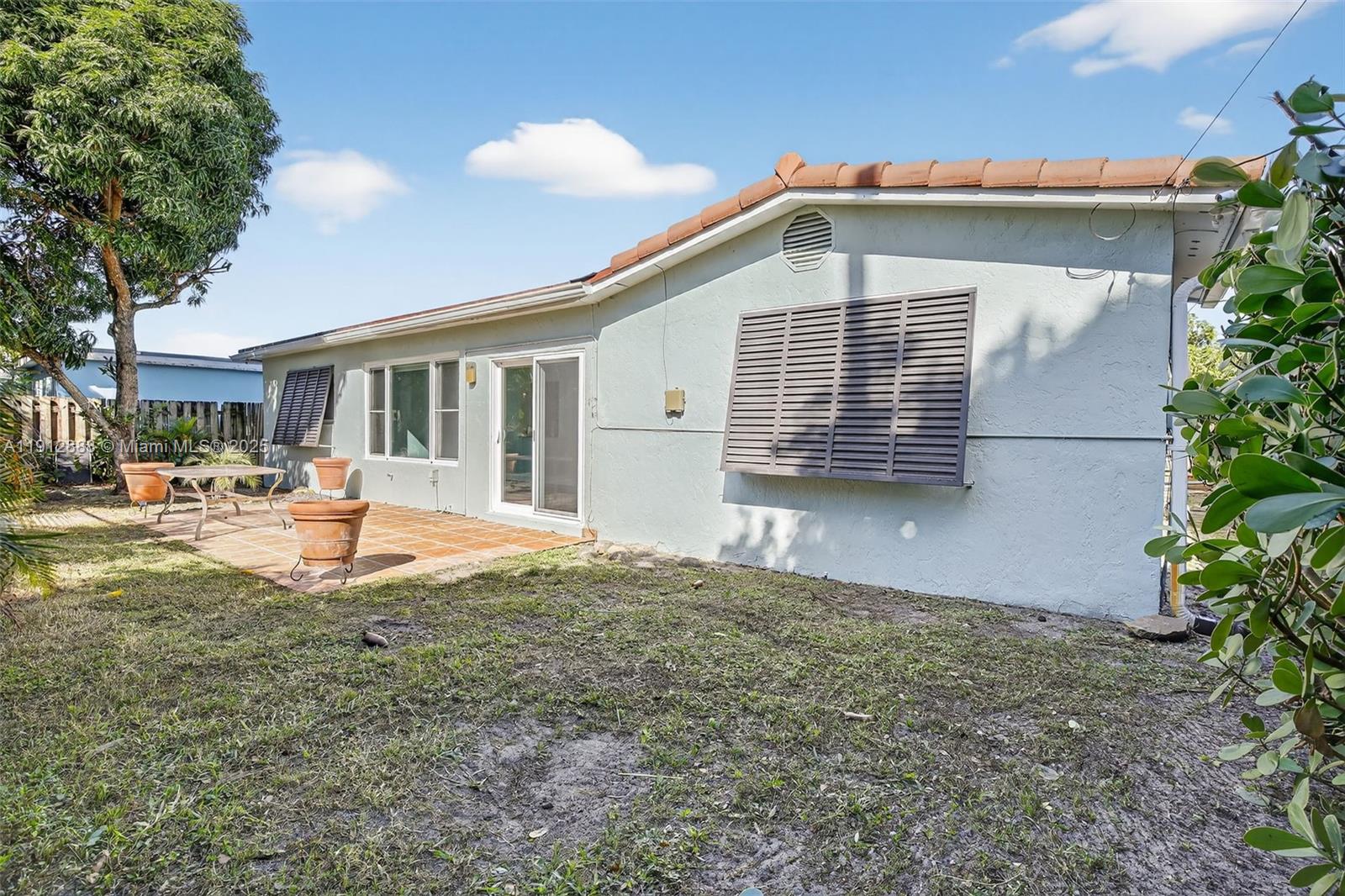 7920 Alhambra Boulevard Miramar, FL 33023 - Photo 35 of 38 a front view of a house with a yard