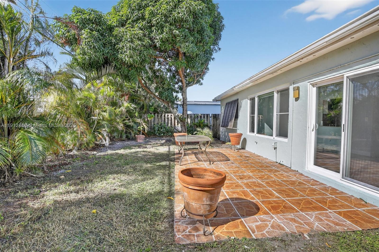 7920 Alhambra Boulevard Miramar, FL 33023 - Photo 36 of 38 a outdoor space with pool and furniture