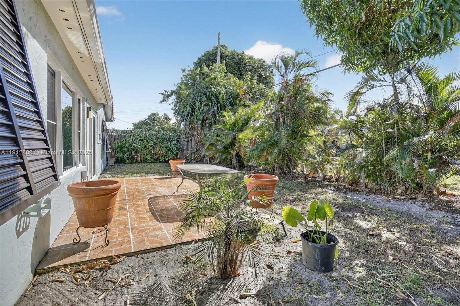 7920 Alhambra Boulevard Miramar, FL 33023 - Photo 38 of 38 a view of an outdoor sitting area with brick walls