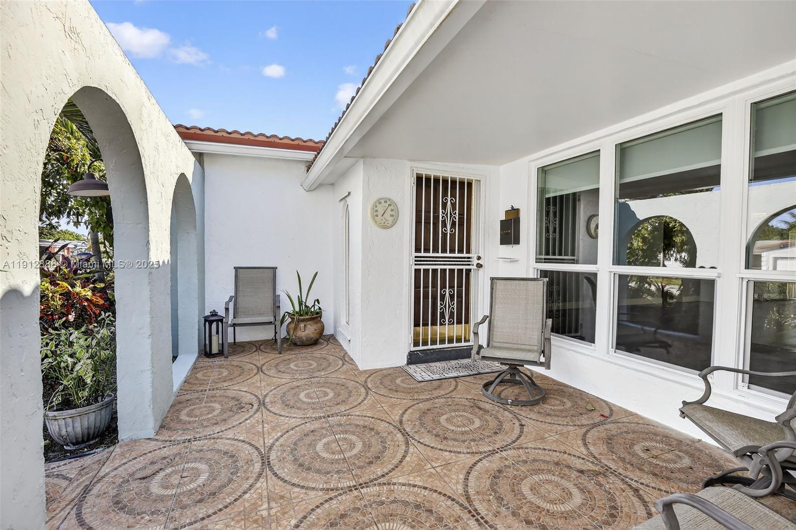 7920 Alhambra Boulevard Miramar, FL 33023 - Photo 4 of 38 a view of a livingroom with furniture and porch