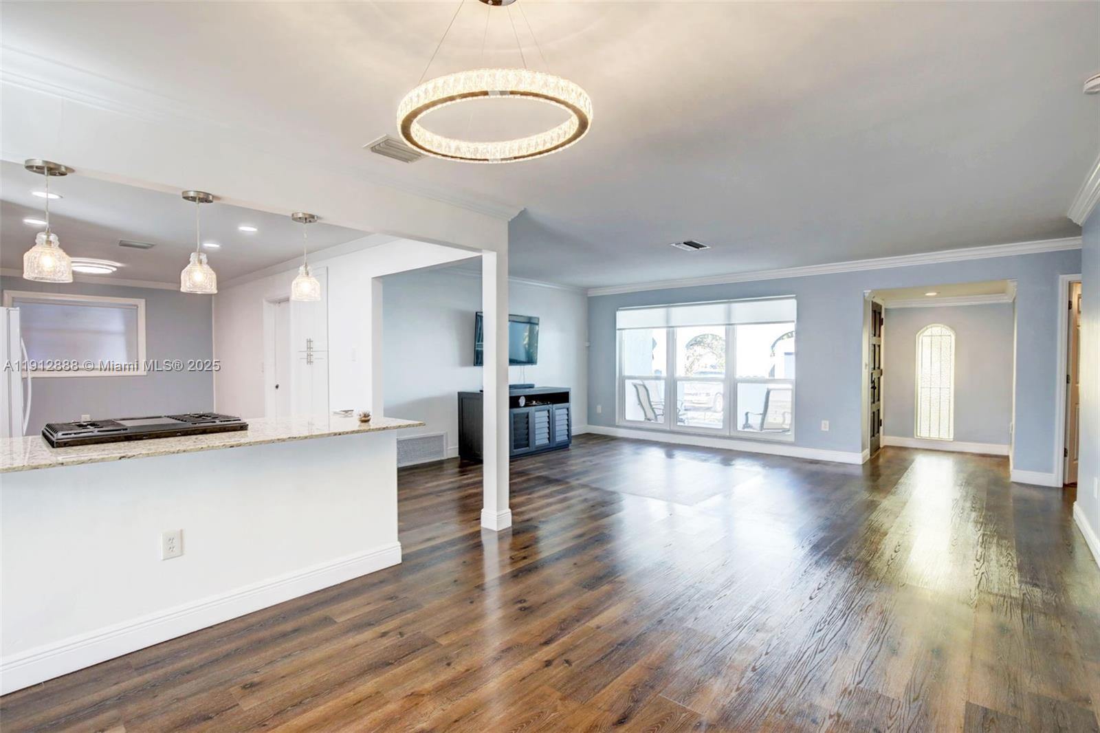 7920 Alhambra Boulevard Miramar, FL 33023 - Photo 10 of 38 a view of kitchen with stove and wooden floor
