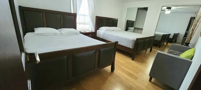 a bedroom with a bed and a dresser