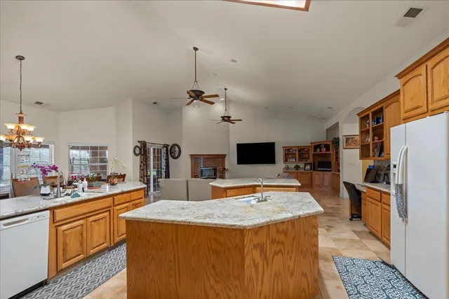 a kitchen with a stove a sink and a refrigerator