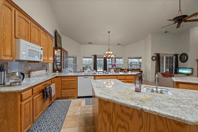 a bedroom with a bed and a flat tv screen on dresser