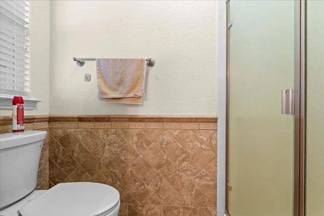 a kitchen with stainless steel appliances granite countertop a refrigerator and a stove