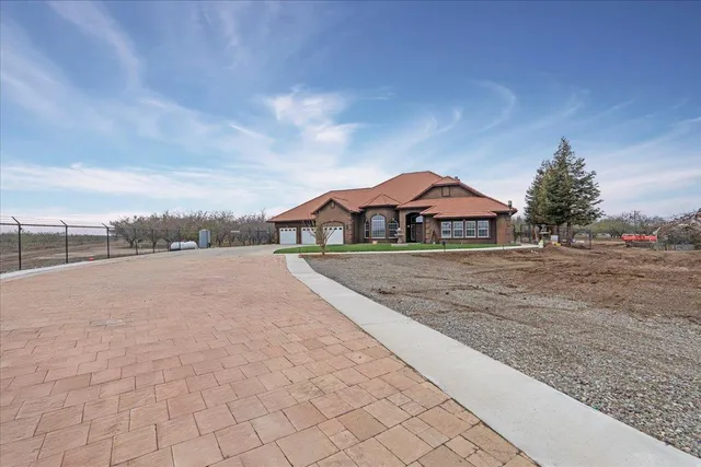 a view of house with yard and street