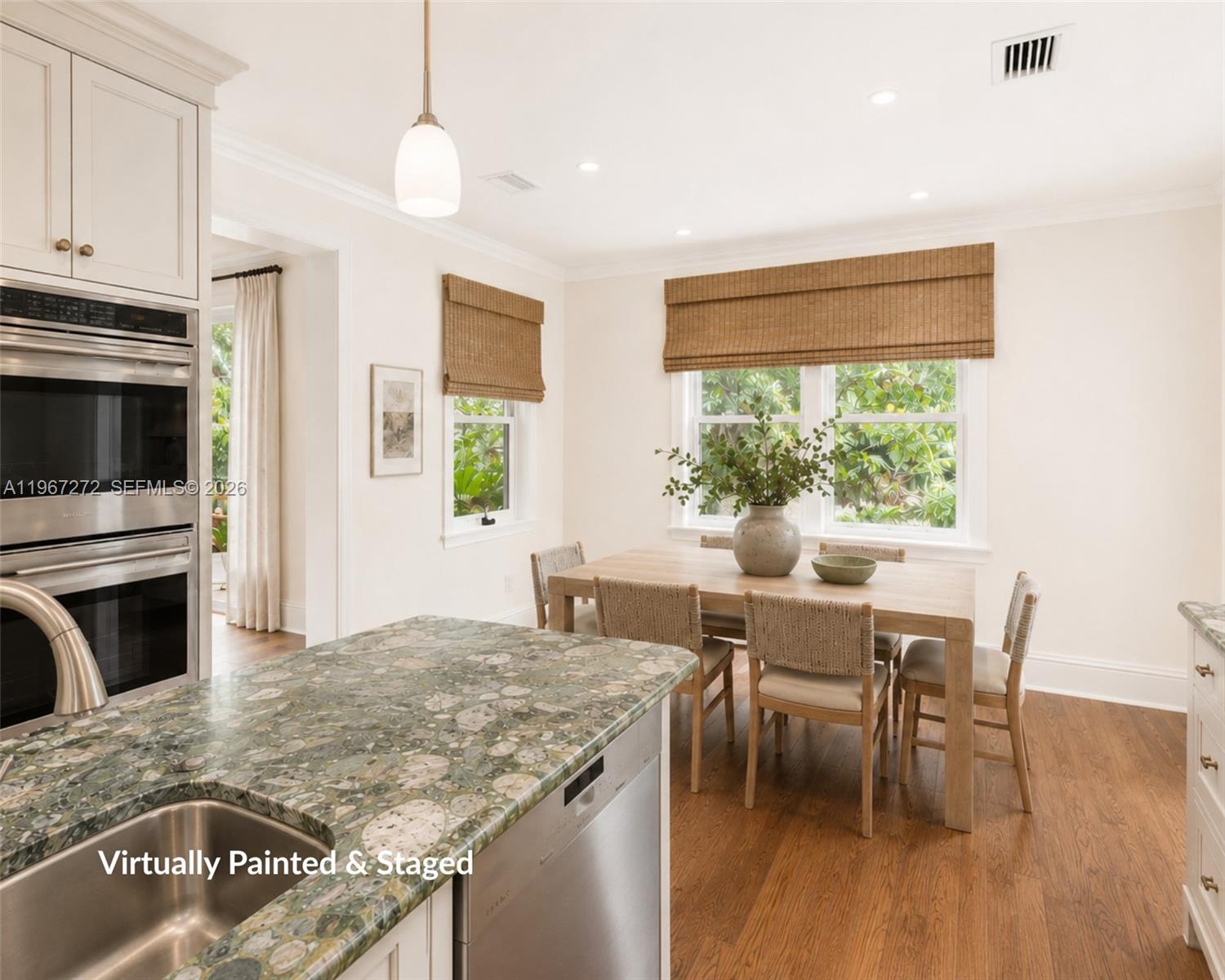4867 Southwest 82nd Street Miami, FL 33143 - Photo 16 of 65 a view of a dining room with furniture window and wooden floor