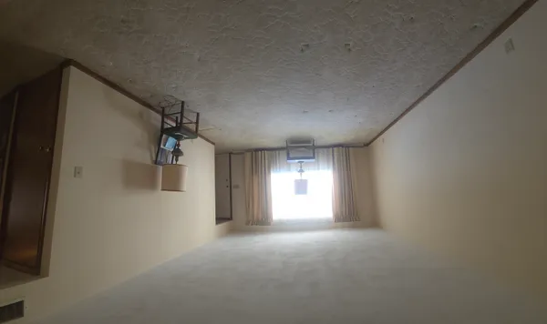 a view of empty room with windows