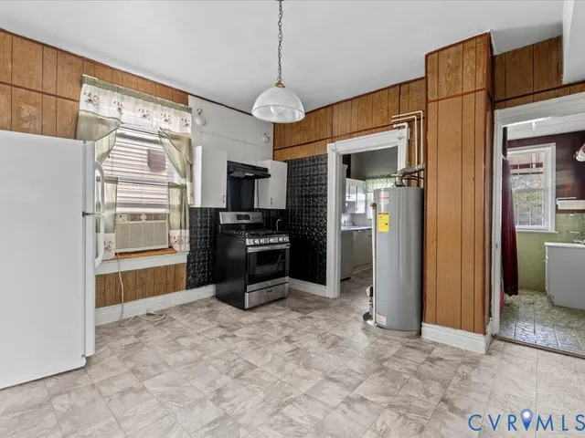 a view of a kitchen with refrigerator and microwave