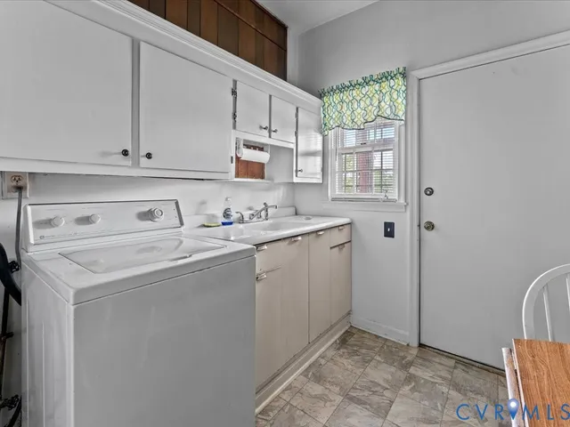 a view of a hallway with brick walls and windows