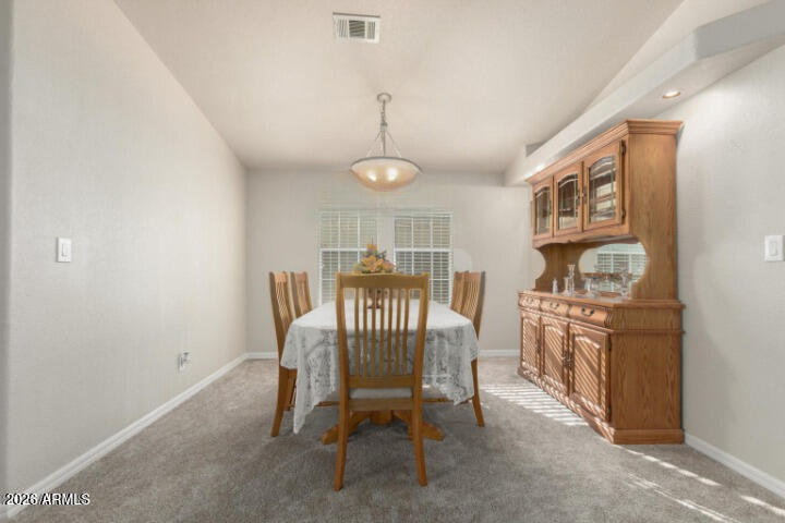 3301 South Goldfield Road, Unit 4086 Apache Junction, AZ 85119 - Photo 18 of 41 a view of a dining room with furniture