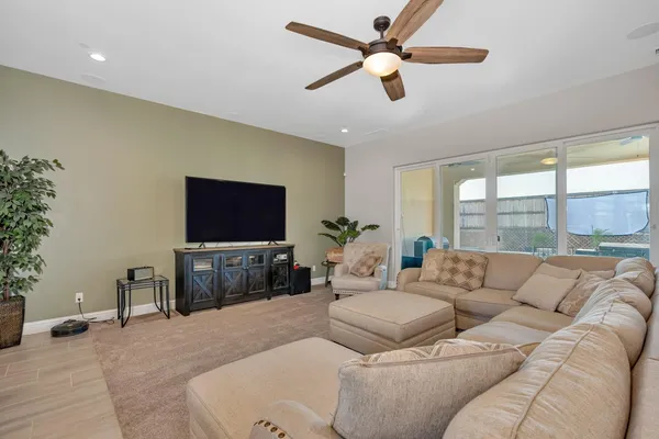 a kitchen with a sink a stove and lots of wooden floor