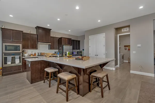 a dining room with furniture and wooden floor