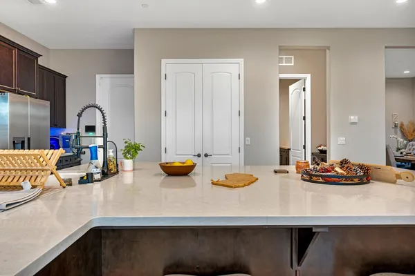 a view of a dining room with furniture and window