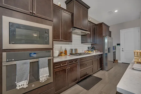 a view of a dining room with furniture and window