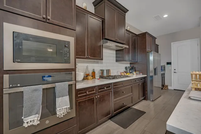 a view of a dining room with furniture and window