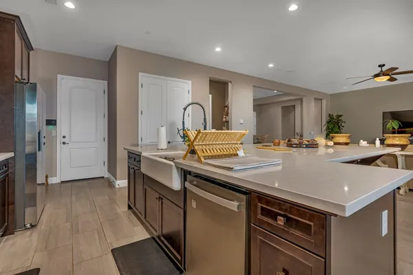 a view of walk in closet with clothes