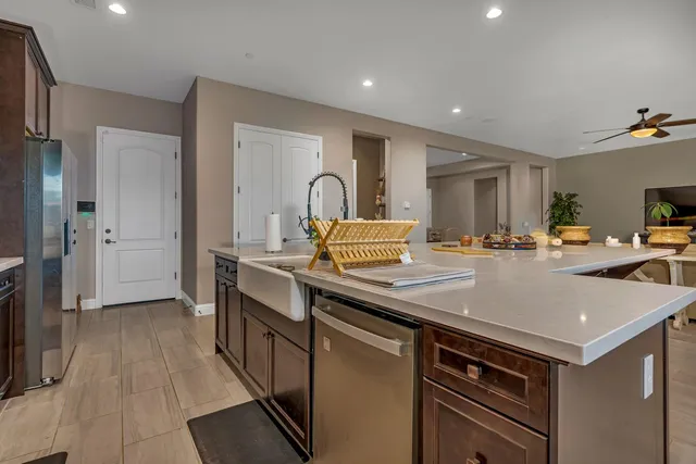 a view of walk in closet with clothes