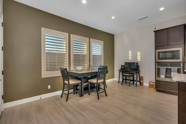 a view of walk in closet with clothes