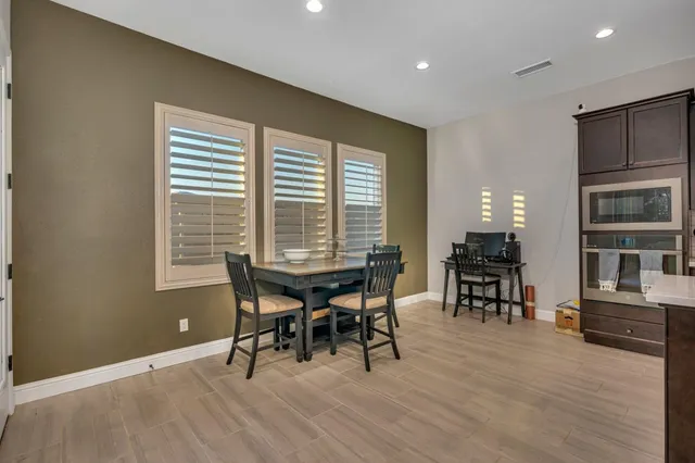 a view of walk in closet with clothes