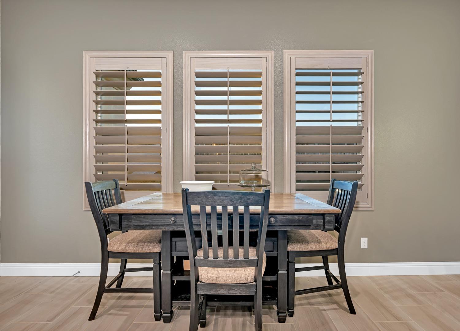 1053 Beaver Pond Loop Madera, CA 93636 - Photo 24 of 81 a view of a dining room with furniture and window