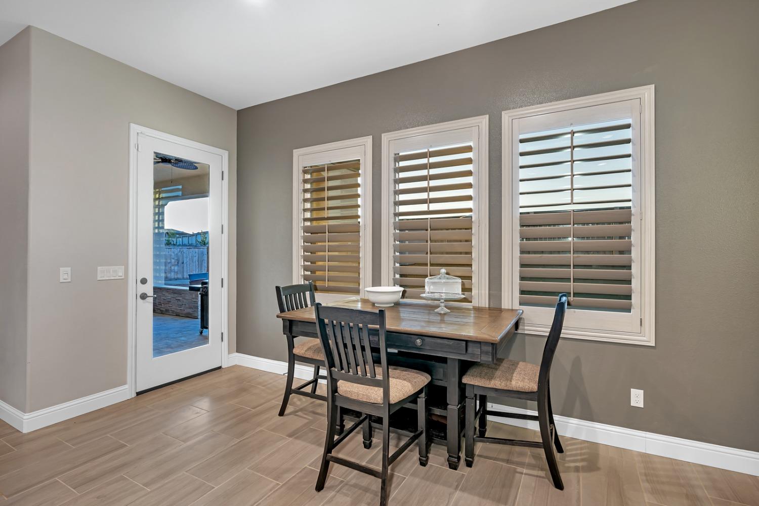 1053 Beaver Pond Loop Madera, CA 93636 - Photo 25 of 81 a view of a dining room with furniture and window