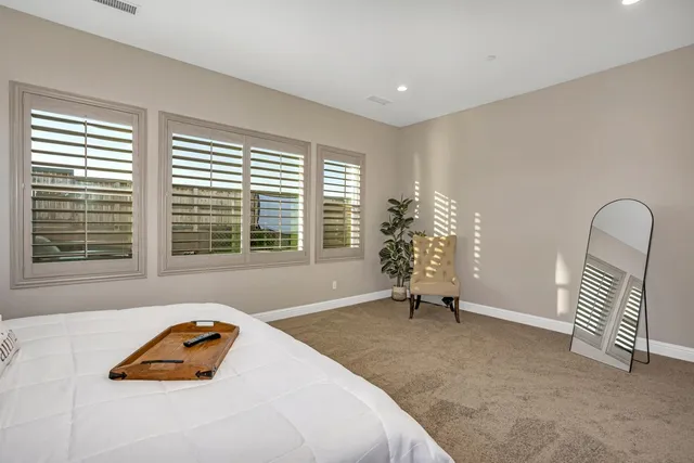 a bathroom with a sink vanity granite and toilet