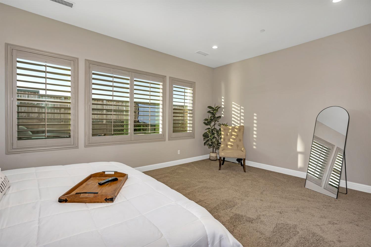 1053 Beaver Pond Loop Madera, CA 93636 - Photo 29 of 81 a bedroom with a bed and a chair